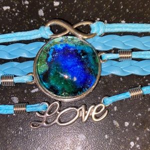Blue Faux Leather Bracelet with Hand Painted Alcohol Ink Art Under Domed Glass